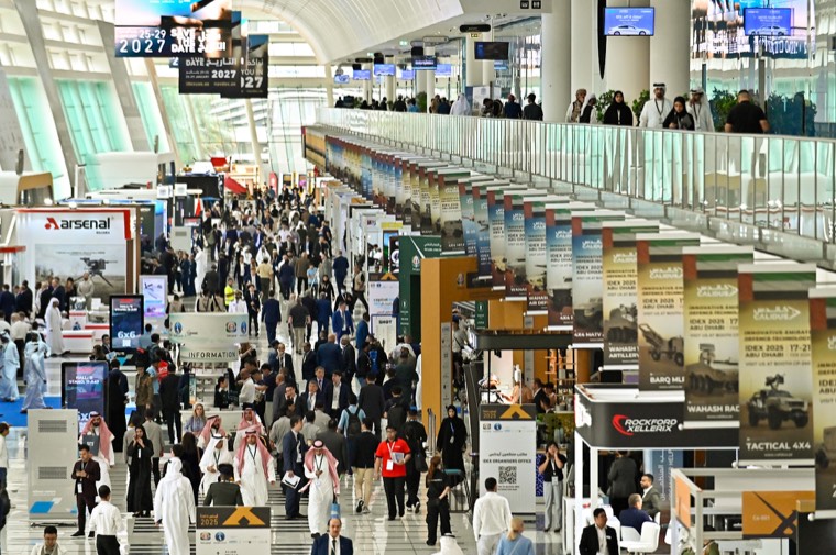 A busy IDEX exhibition concourse viewed from above
